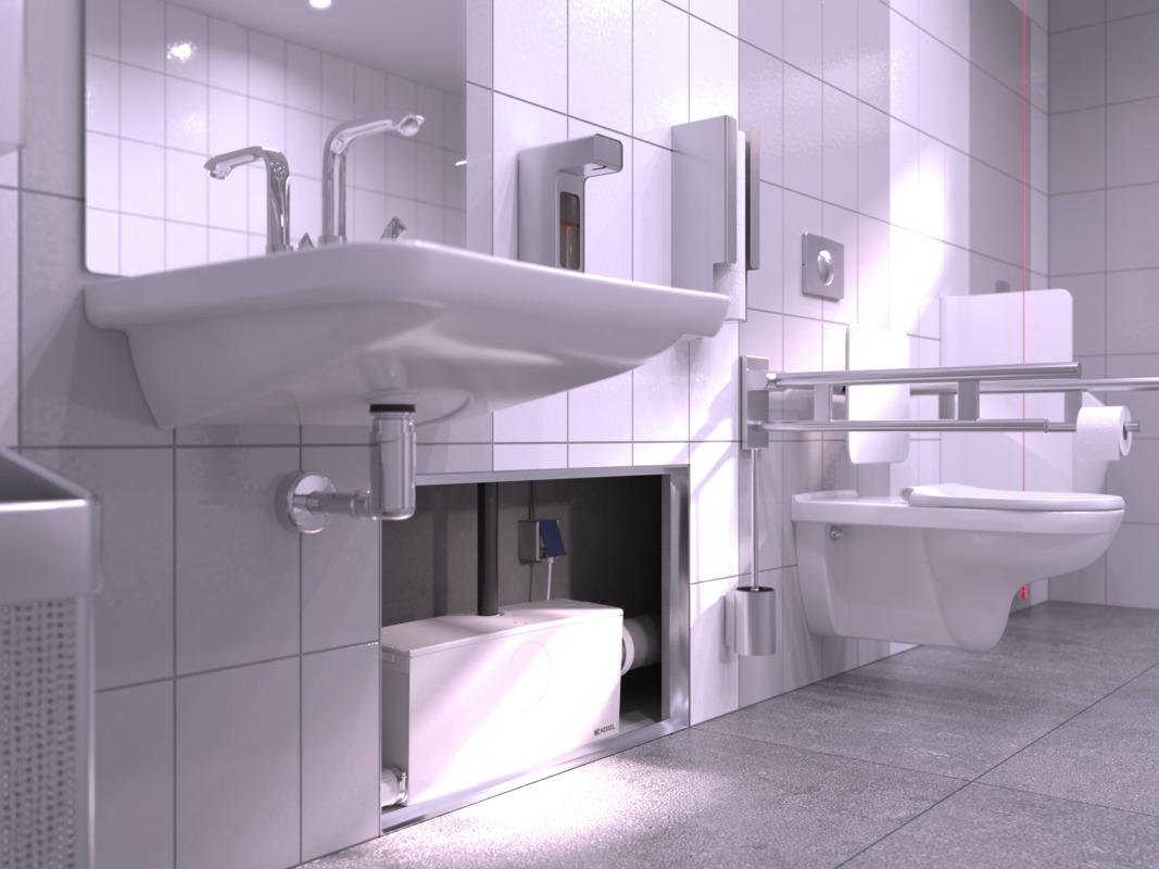 Gros plan sur un petit poste de relevage encastré dans la cloison, à lequel sont raccordés des toilettes et un lavabo.