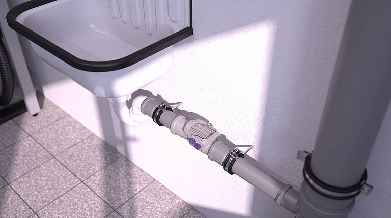 Clapet antiretour Staufix DN 50 installé dans une conduite d'eaux usées hors sol Clapet antiretour Staufix DN 50 installé dans une conduite d'eaux usées hors sol