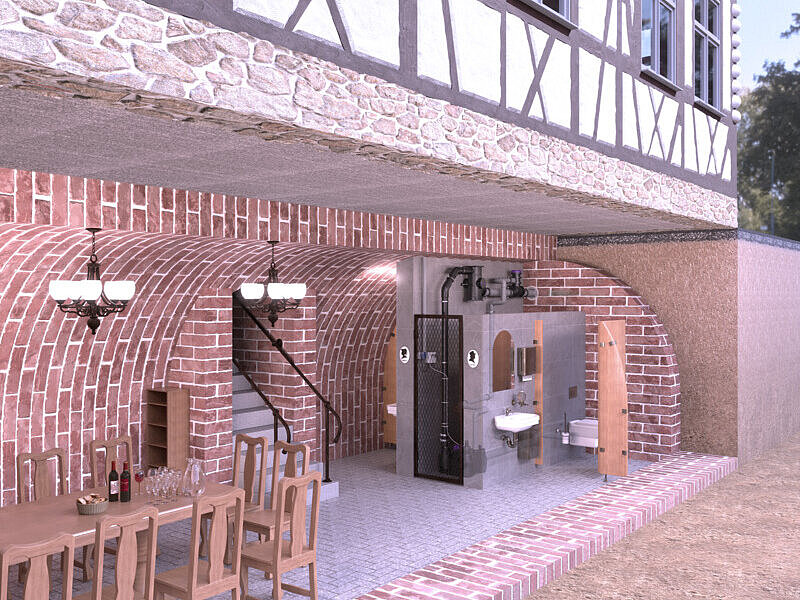 Illustration de l'installation dans une ancienne cave voûtée, avec des toilettes installées a posteriori, un séparateur CleverLoop et un dérivateur de ventilation CleverVent.
