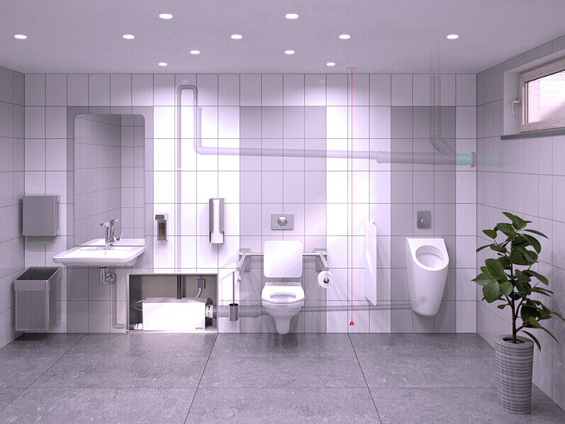 Salle de bains au sous-sol équipée d'un lavabo, d'un urinoir et de toilettes, dont l'évacuation est assurée par un petit poste de relevage intégré dans la cloison.