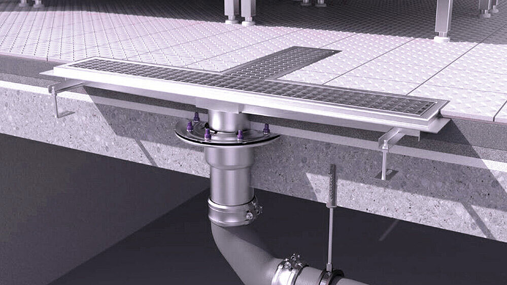 Caniveau de drainage en acier inoxydable dans une cuisine. Caniveau de drainage en acier inoxydable dans une cuisine.