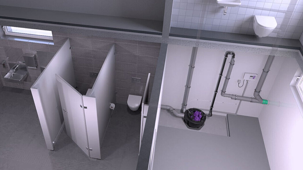 Exemple d'installation d'une station de relevage dans des toilettes publiques
