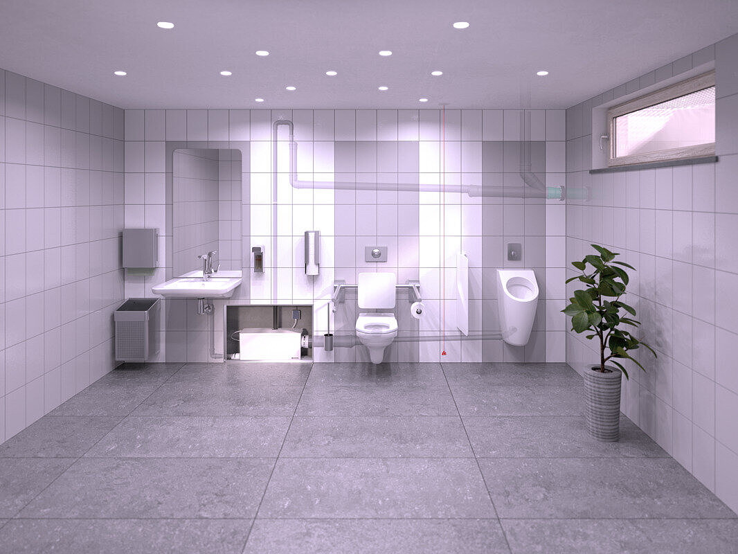 Illustration d'une installation dans les toilettes d'un restaurant situées au sous-sol, où un lavabo, un urinoir et des toilettes sont raccordés au petit poste de relevage Minilift L WC Duo, dissimulé dans une installation en applique.