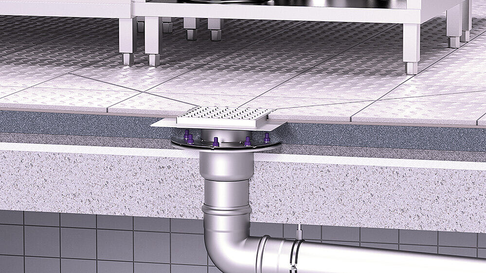 Exemple d'installation d'un siphon de sol Ferrofix en acier inoxydable dans une cuisine professionnelle